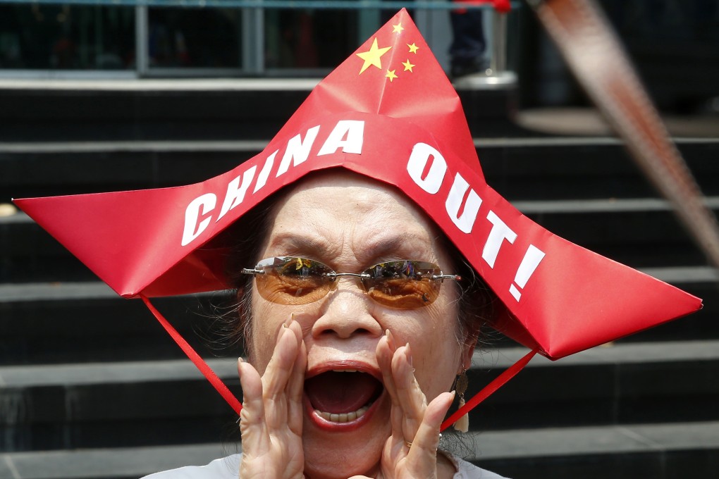 A Philippine protester outside the Chinese consulate in Makati. Photo: AP