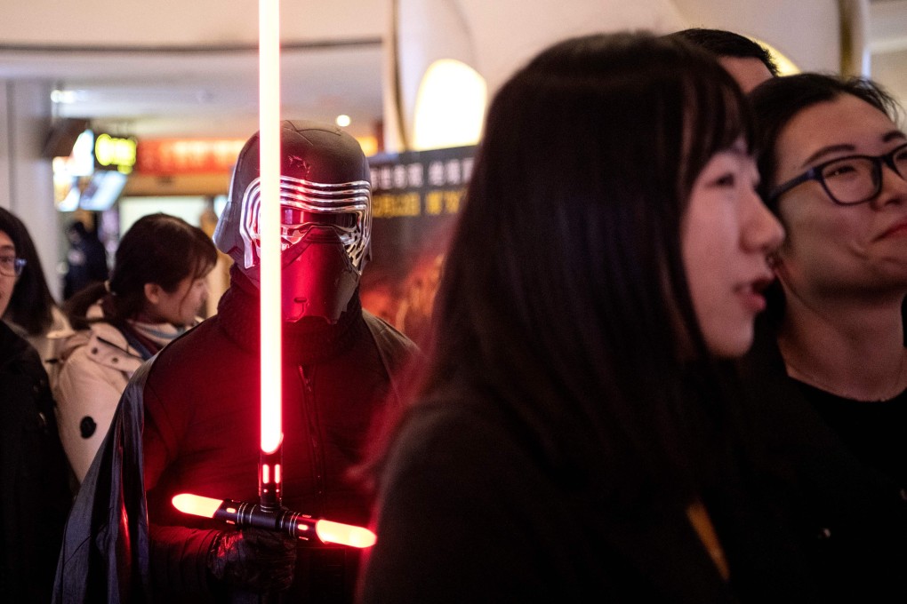 Movie-goers queue to watch The Rise of Skywalker at a mall in Beijing on Friday. Photo: AFP