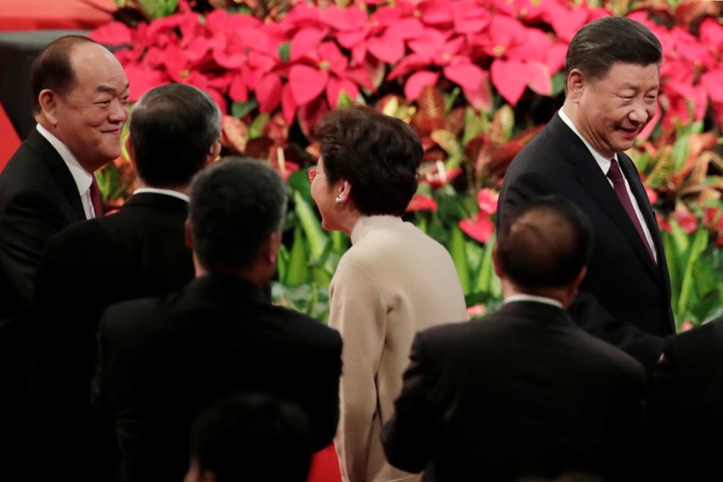 Chinese President Xi Jinping (right), new Macau Chief Executive Ho Iat-seng (left) and Hong Kong Chief Executive Carrie Lam attend a ceremony to inaugurate the new Macau government. Photo: Reuters