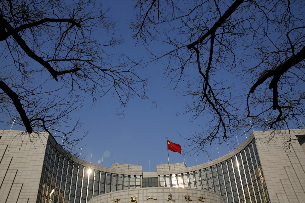 FILE PHOTO: A Chinese national flag flies at the headquarters of the People's Bank of China, the country's central bank, in Beijing, China, January 19, 2016. REUTERS/Kim Kyung-Hoon/File Photo