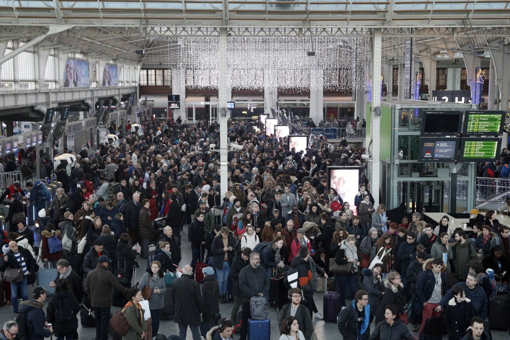 Commuters and travellers at a crowded Gare de Lyon railway station in Paris on Saturday. Photo: EPA