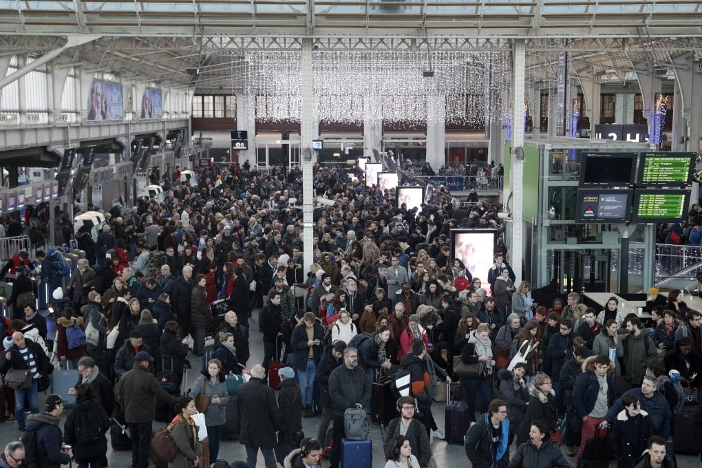 Commuters and travellers at a crowded Gare de Lyon railway station in Paris on Saturday. Photo: EPA