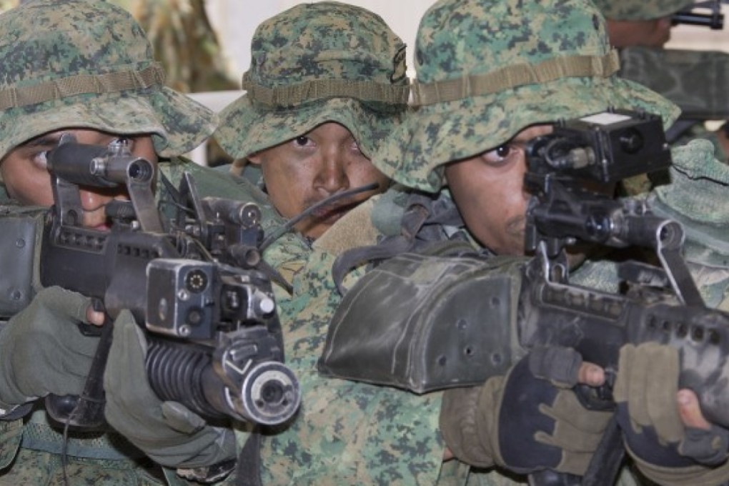 Singapore troops demonstrate urban assault techniques in an exercise in Australia. File photo: Australian Government Department of Defence