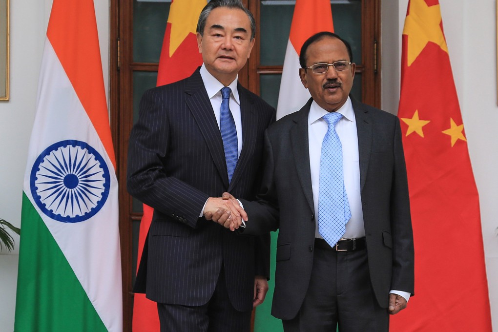 Chinese Foreign Minister Wang Yi (left) meets Indian national security adviser Ajit Doval for border talks in New Delhi on Saturday. Photo: Xinhua