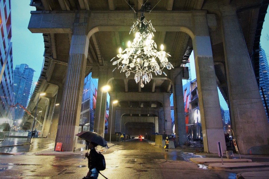 The Spinning Chandelier kinetic sculpture descends from under the Granville Bridge on a rainy Vancouver afternoon. Photo: Ian Young