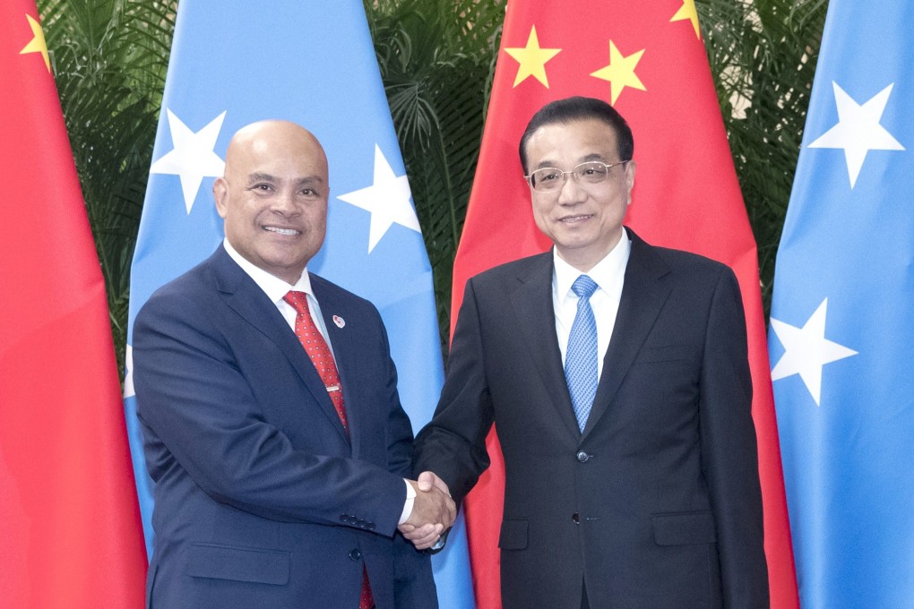 President of the Federated States of Micronesia David Panuelo shakes hands with Chinese Premier Li Keqiang at the Great Hall of the People in Beijing. Photo: Xinhua