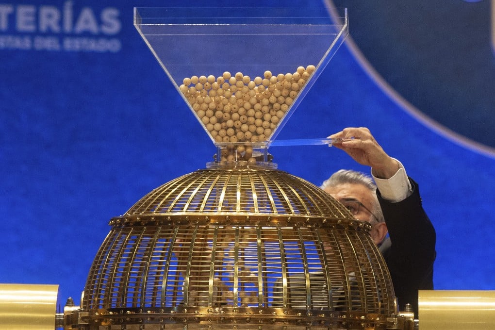 A worker prepares the numbered lottery balls at Madrid's Teatro Real opera house. Photo: AP Photo