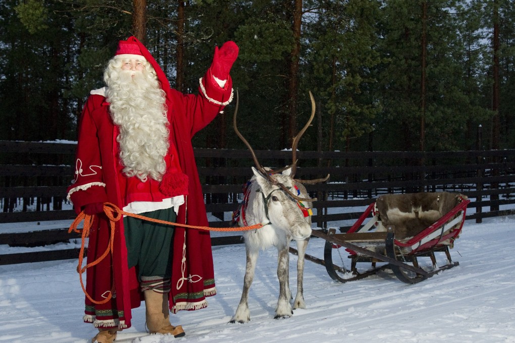 Santa Claus and his reindeer in Rovaniemi, Lapland, in Finland. Photo: AFP