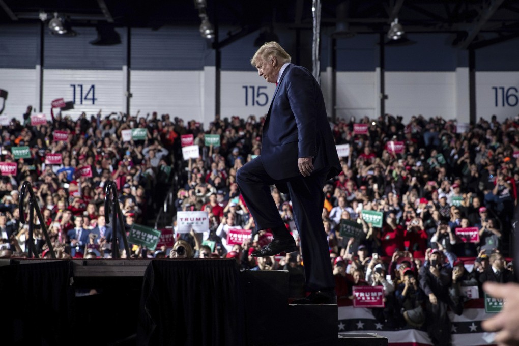 US President Donald Trump arrives at W.K. Kellogg Airport in Michigan to attend a campaign rally on December 18, as the House of Representatives voted to impeach him. Photo: AP