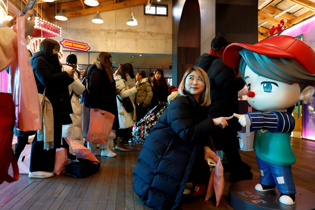 K-pop management agencies have been expanding their retail operations to capitalise on a merchandising boom. Photo: Reuters