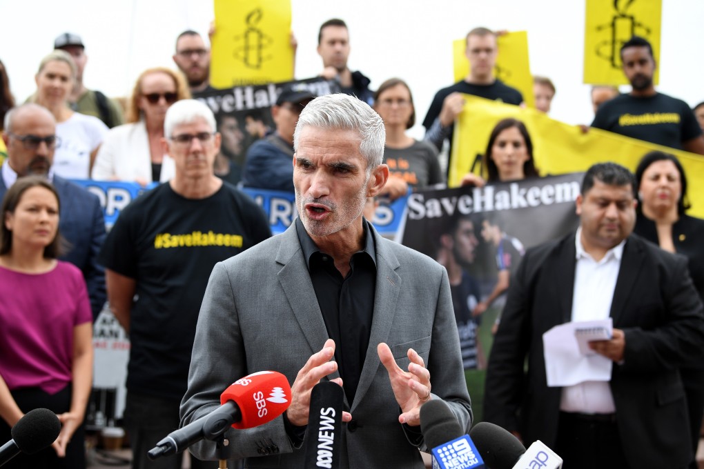 Former Socceroo Craig Foster speaks at a rally in support of Hakeem al-Araibi in February. Photo: EPA