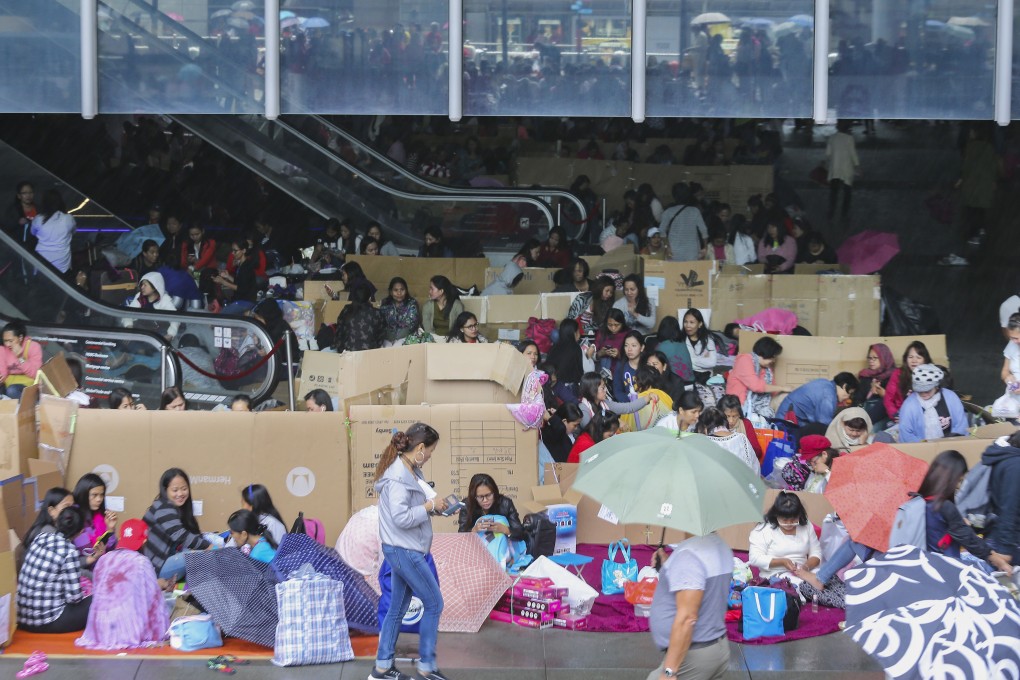 Domestic helpers often use their day off to meet friends and send money home. Photo: Dickson Lee
