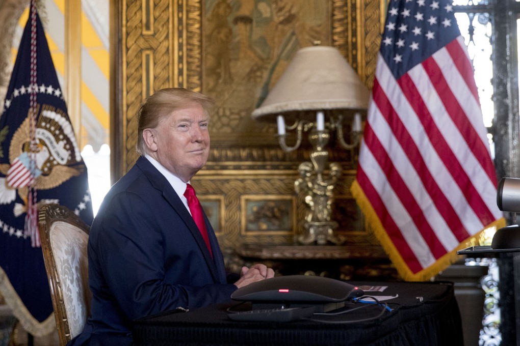 US President Donald Trump looks towards members of the media as he speaks during a Christmas Eve video teleconference with members of the military at his Mar-a-Lago estate in Florida on Tuesday. Photo: AP