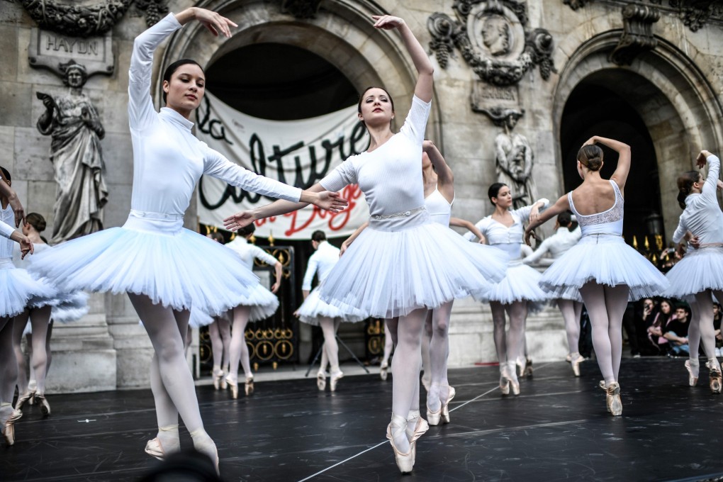 Paris Opera dancers perform in front of the Palais Garnier in Paris on Tuesday in protest against the French government's plan to overhaul the country's retirement system. Photo: AFP