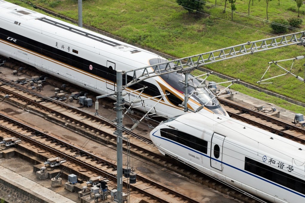 A Fuxing bullet train (L) is seen running on the Beijing-Shanghai high-speed railway. Photo: Xinhua