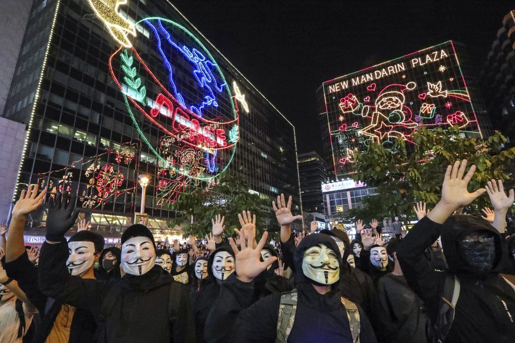 The anti-government protests have seen businesses cut spending on Christmas lighting across the city. Photo: Felix Wong