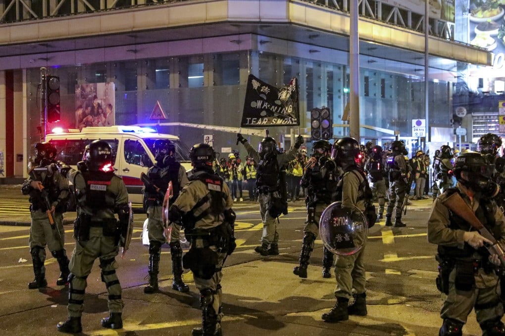 Police fire tear gas to disperse anti-government protesters on Nathan Road in Mong Kok. Photo: May Tse