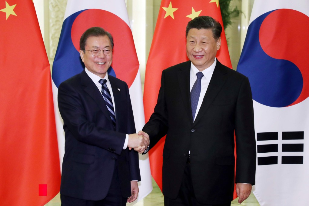 South Korean President Moon Jae-in (left) and his Chinese counterpart Xi Jinping meet in Beijing on Monday. Photo: AFP