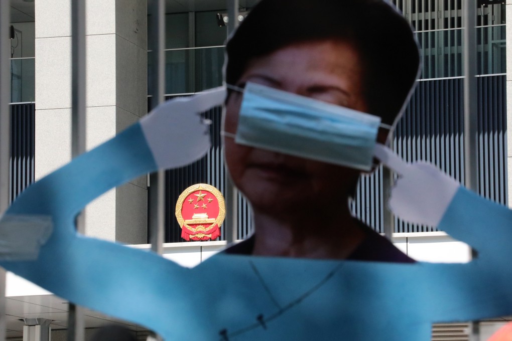 Protesters put up an effigy of Chief Executive Carrie Lam Cheng Yuet-ngor covering her ears and eyes, in light of perceived government inaction over months of protests and the protesters’ five demands, including an inquiry into police action, in Admiralty on October 16. Photo: Felix Wong