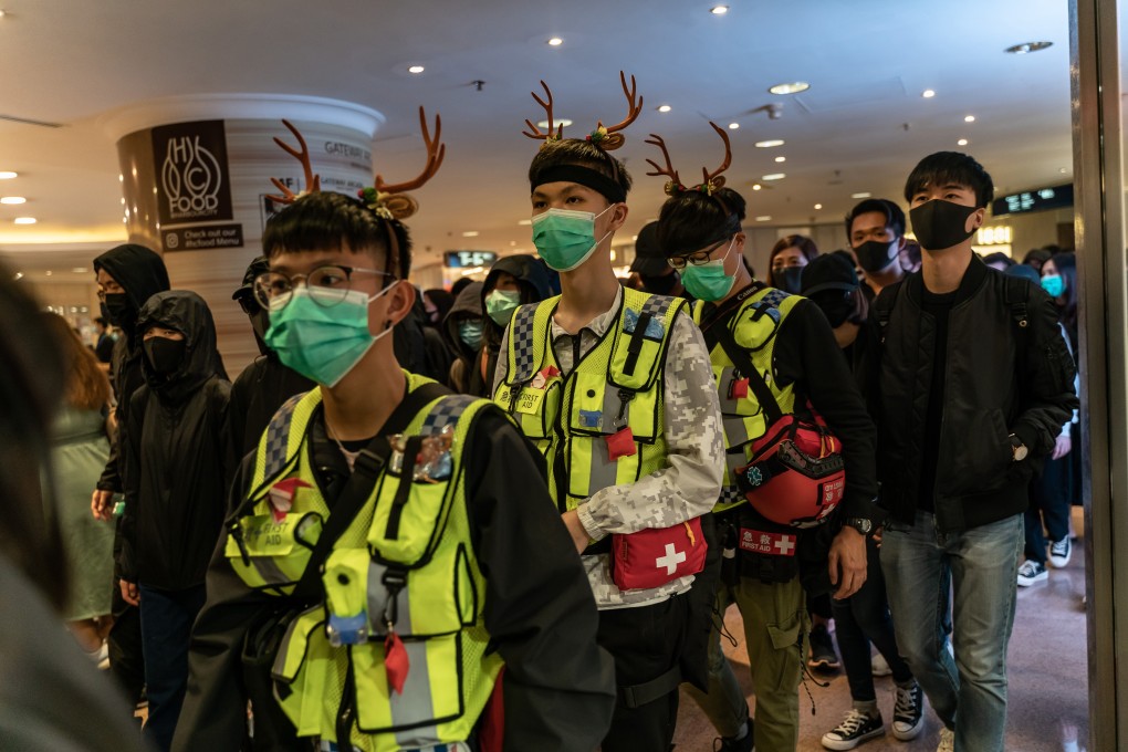 Volunteer medics join a demonstration inside a shopping mall in Hong Kong on Christmas Eve. Photo: Getty Images/TNS