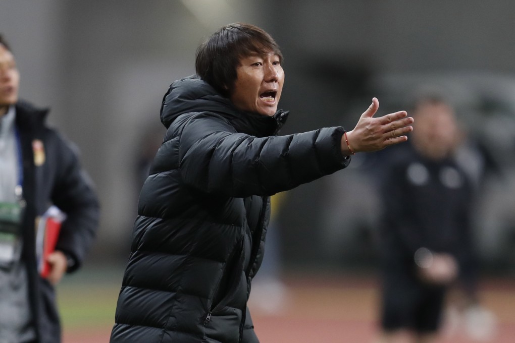 Li Tie shouts instructions to his players while in charge of China during the EAFF E-1 Championship match against South Korea. Photo: EPA
