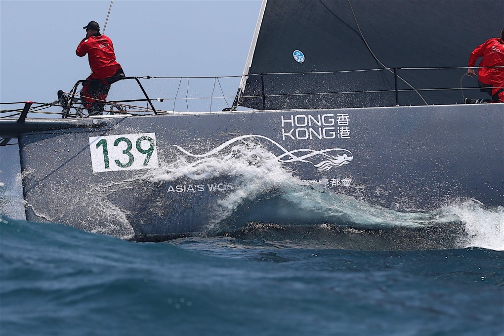 Sun Hung Kai/Scallywag sails out of Sydney harbour at the start of the Sydney to Hobart yacht race. Photo: AFP