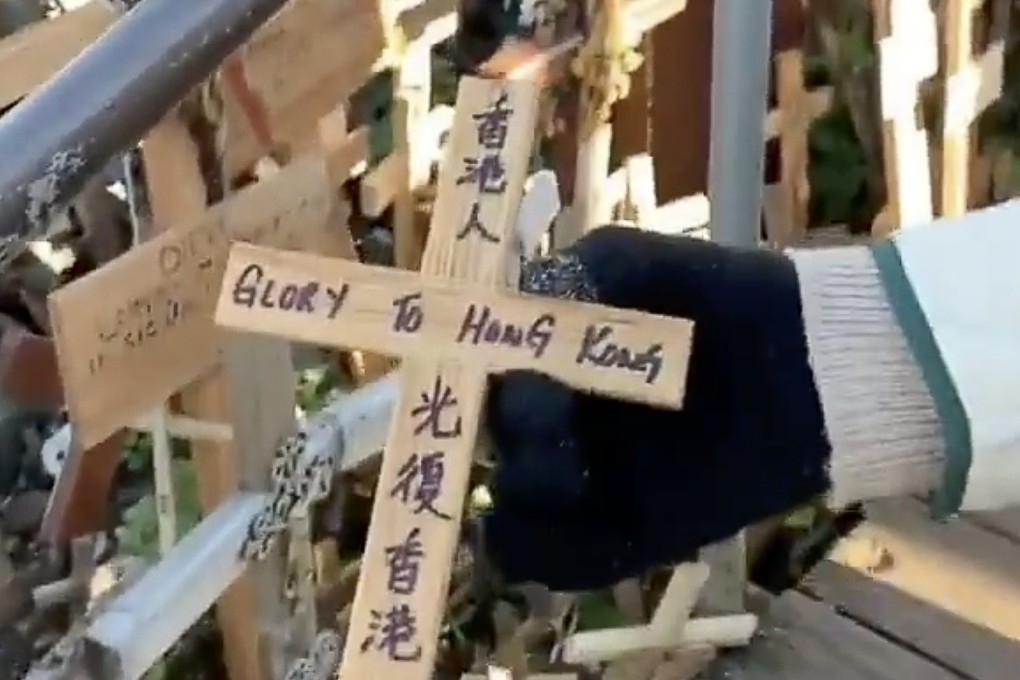 Lithuania is investigating after a cross marking the Hong Kong protests placed at the Hill of Crosses, near the city of Siauliai, was plucked from the ground and thrown by a Mandarin-speaking visitor. Photo: Twitter