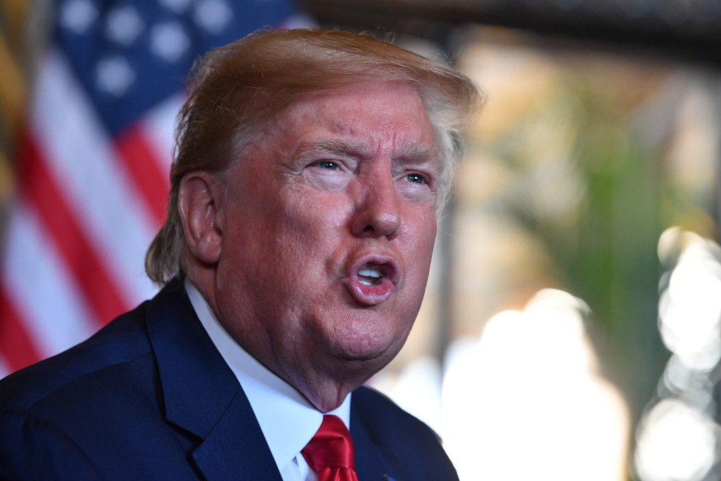 US President Donald Trump answers questions from reporters after making a video call to the troops stationed worldwide at the Mar-a-Lago estate in Palm Beach Florida. Photo: AFP