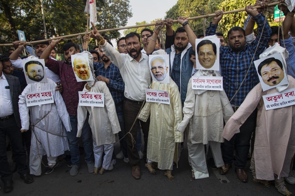 Activists hang the effigies of Indian Prime Minister Narendra Modi and his ministers, protesting against the Citizenship Amendment Bill. Photo: AP