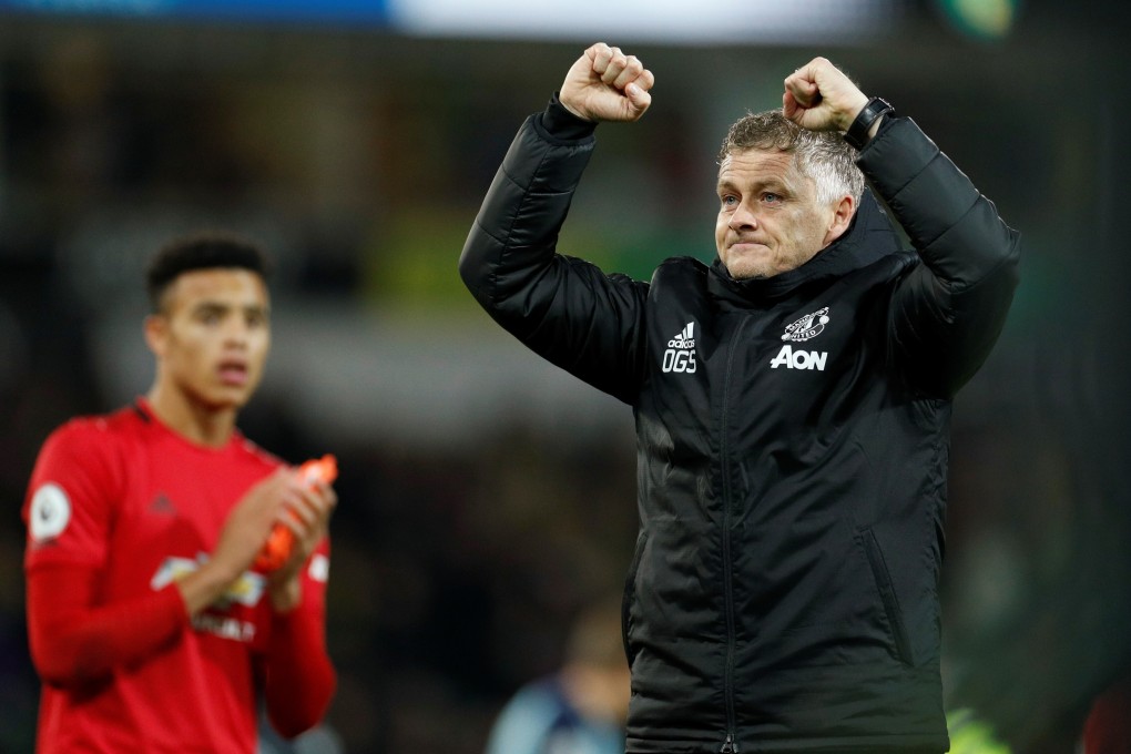 Manchester United manager Ole Gunnar Solskjaer celebrates victory as teen striker Mason Greenwood looks on. Photo: Reuters