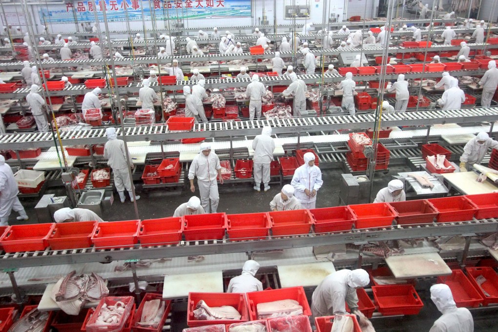 Workers in a meat processing plant. Photo: EPA