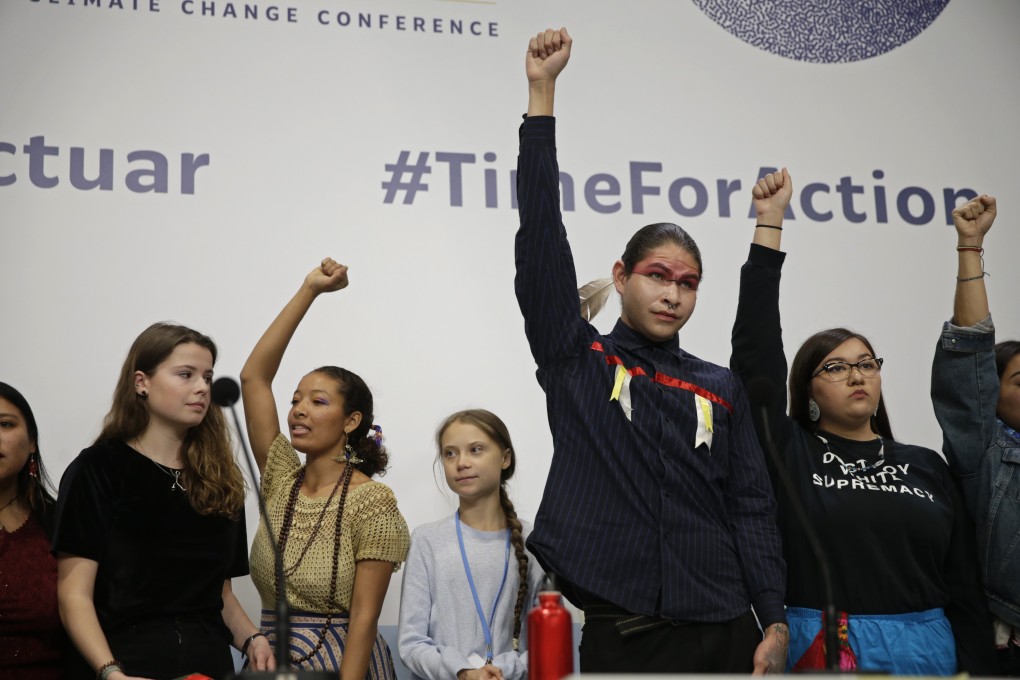 Greta Thunberg, centre, stands with other young activists at COP25, the 2019 UN Climate Change Conference, in Madrid on December 9. Photo: AP