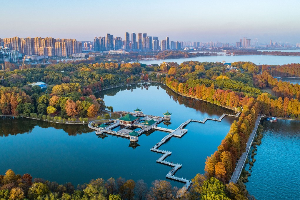 Donghu Lake in Wuhan, the capital of central China’s Hubei province, is flanked by high-rise buildings in July. China is undergoing rapid urbanisation, with nearly 60 per cent of the population living in cities. Photo: Xinhua
