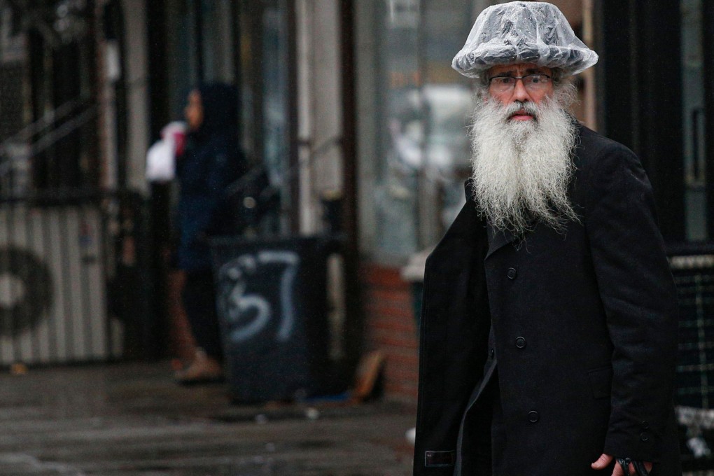 Police, state troopers and civilian volunteers stood guard at a Hasidic synagogue in Brooklyn on Monday as Orthodox Jews marked the end of Hanukkah under heightened security. Photo: AFP
