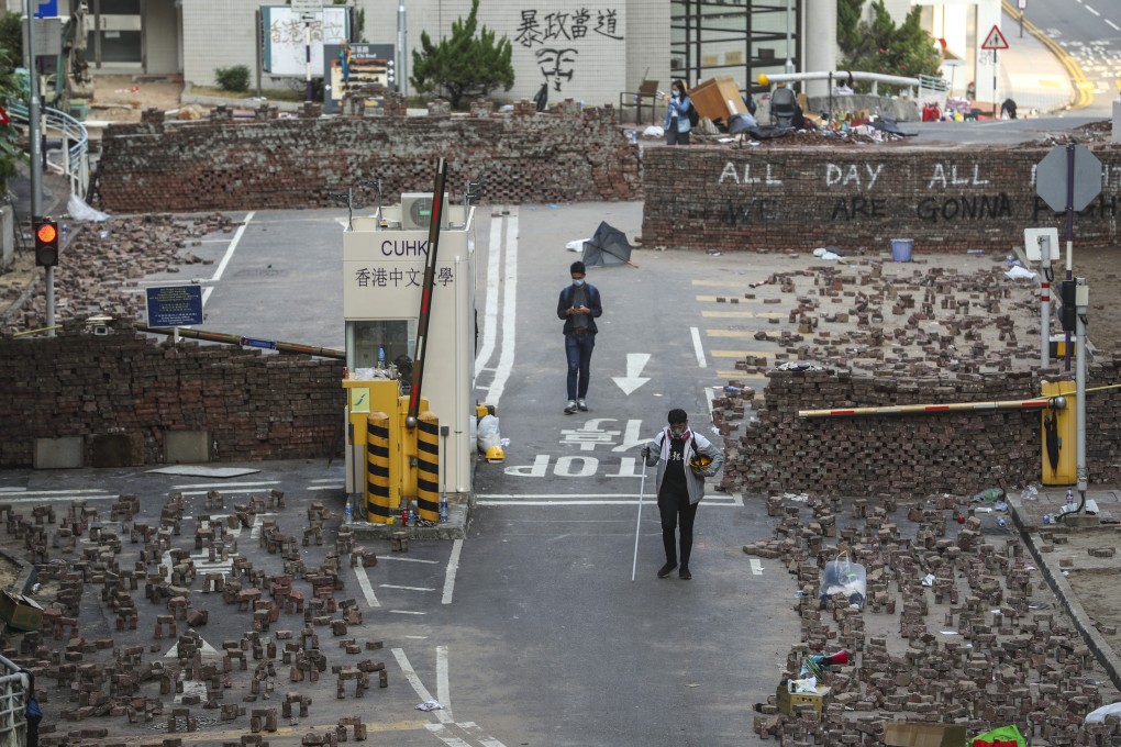 Protesters set up roadblocks with bricks and other materials outside Chinese University in Sha Tin in preparation for clashes with riot police on November 14. Photo: Sam Tsang