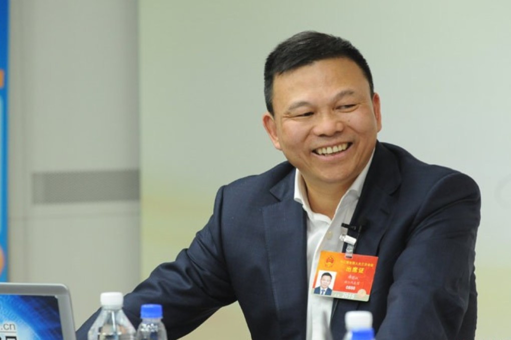 Zheng Jianjiang, seen in an interview with a TV presenter, made his fortune manufacturing air conditioners. Photo: Xinhua