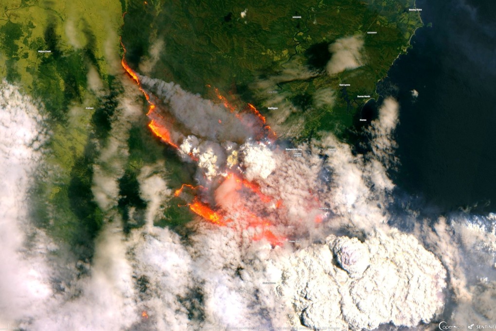 A satellite image of the Batemans Bay area shows smoke and flames from bush fires in Australia. Photo: Reuters