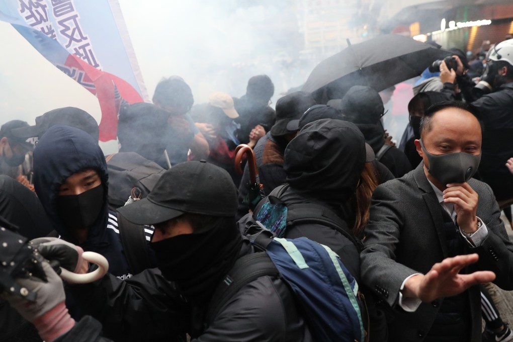 Tear gas is fired at protesters in Wan Chai during the New Year's Day march. Photo: Sam Tsang