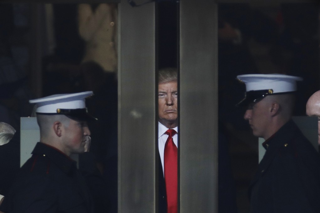 Donald Trump waits to step out onto the portico for his presidential inauguration in 2017. File photo: AP