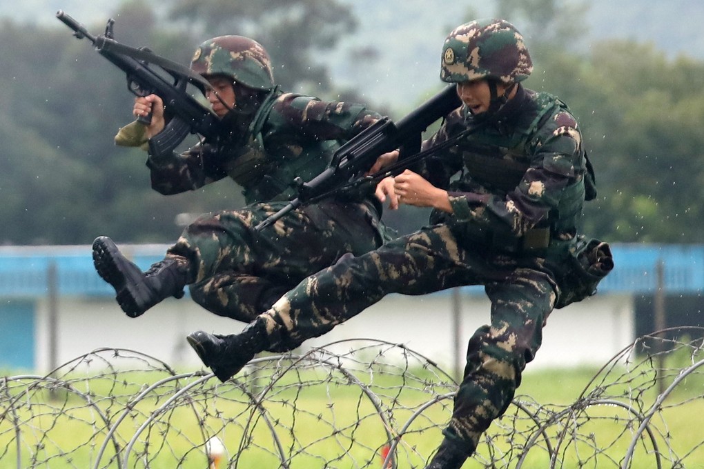 People’s Liberation Army (PLA) personnel demonstrate their skills in Yuen Long. Photo: Xiaomei Chen