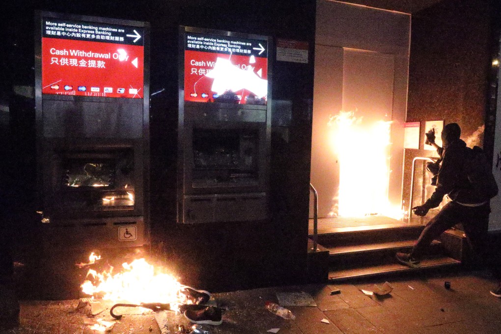 Fire being lit at HSBC’s branch in Wan Chai during the New Year's Day march organised by the Civil Human Rights Front on January 1. Photo: Dickson Lee
