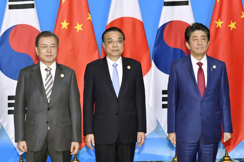 South Korea’s President Moon Jae-in, Chinese Premier Li Keqiang and Japanese Prime Minister Shinzo Abe are pictured ahead of the trilateral summit in Sichuan province, during which they shared their desire for peace and economic prosperity. Photo: AFP