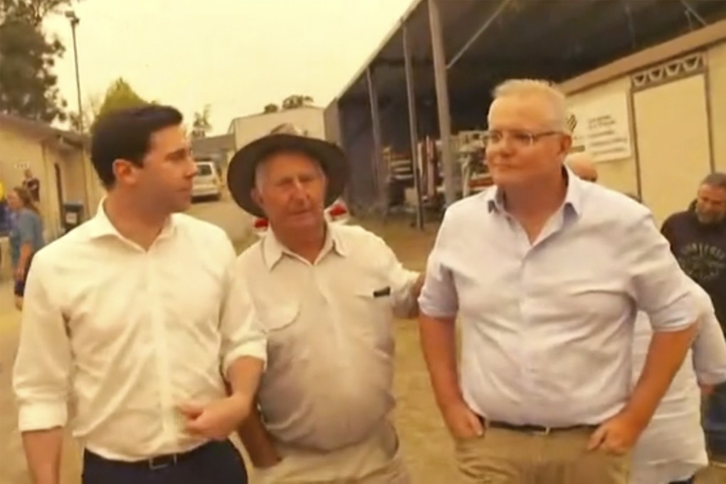 Australian Prime Minister Scott Morrison, right, is confronted by angry residents. Photo: ABC via AP