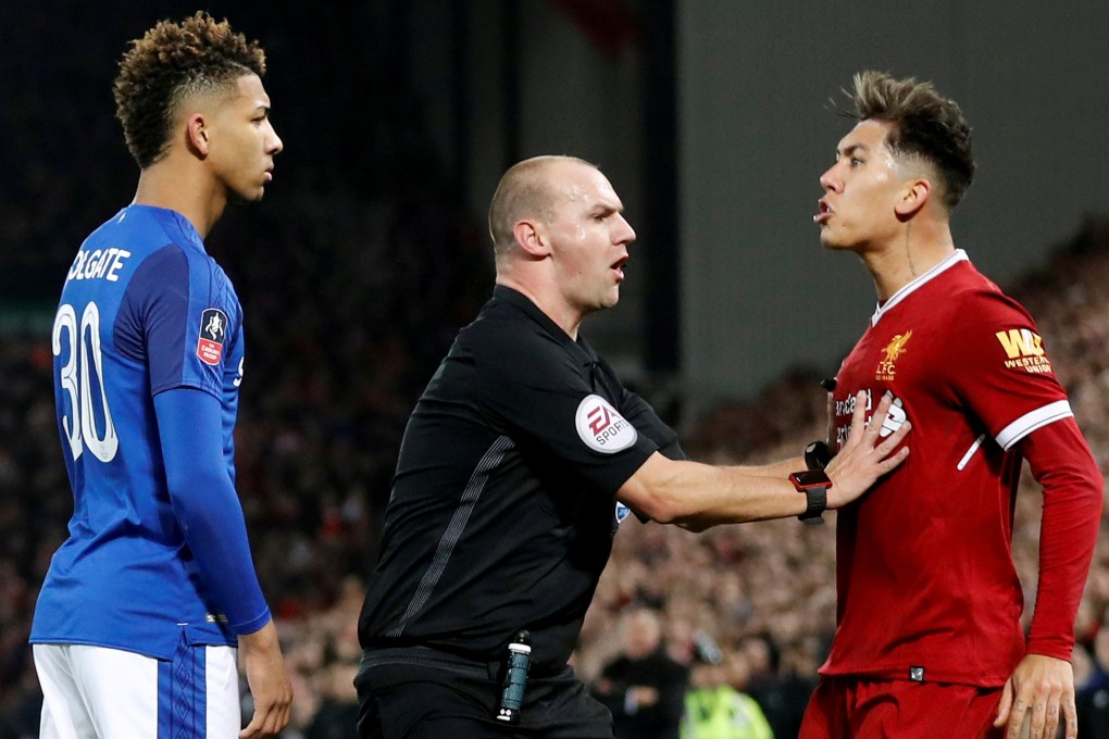 Referee Robert Madley has to separate Everton’s Mason Holgate and Liverpool’s Roberto during a FA Cup clash in 2018. Photo: Reuters