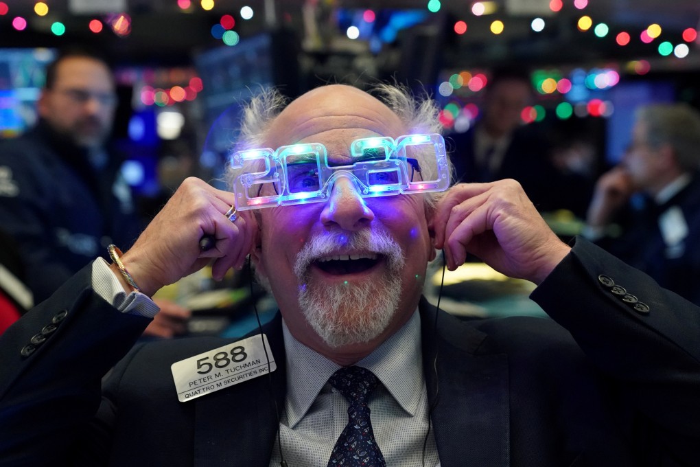 Trader Peter Tuchman wears 2020 glasses to celebrate the New Year at the New York Stock Exchange on Tuesday. Photo: Reuters