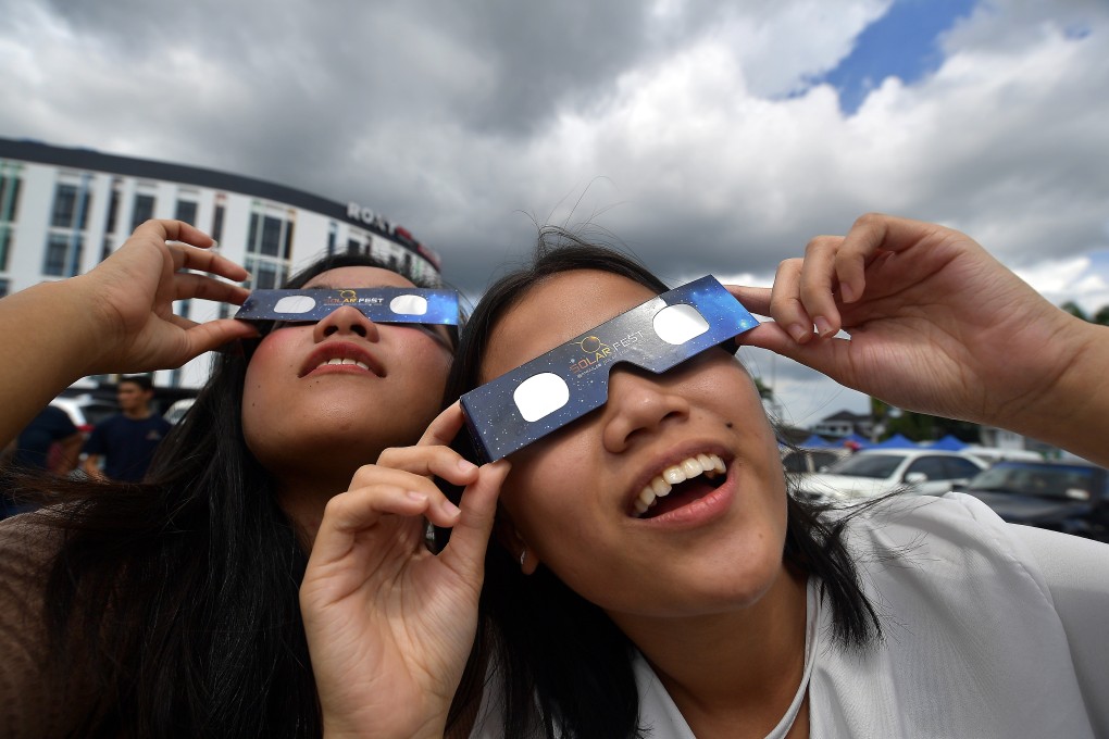 People gear up for a solar eclipse at the National Planetarium in Kuala Lumpur, Malaysia, on December 24, two days before the solar eclipse on December 26. Malaysia launched its Vision 2020 plan in 1991 – to lay out a vision 30 years into the future was breathtaking in its audacity. Photo: Bernama / DPA