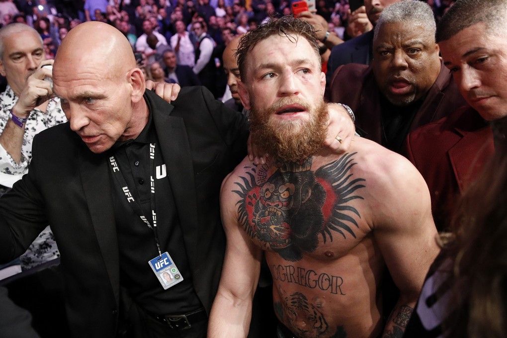 Conor McGregor is escorted from the cage area after fighting Khabib Nurmagomedov at UFC 229 in Las Vegas. Photo: AP