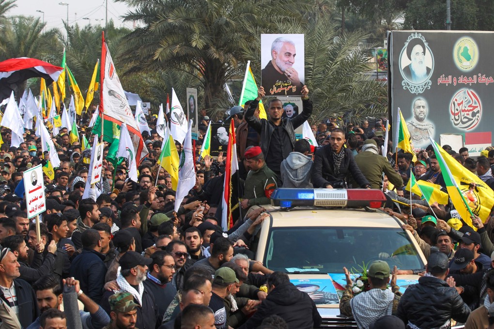 Mourners surround a car carrying the coffin of Iranian military commander Qasem Soleimani. Photo: AFP
