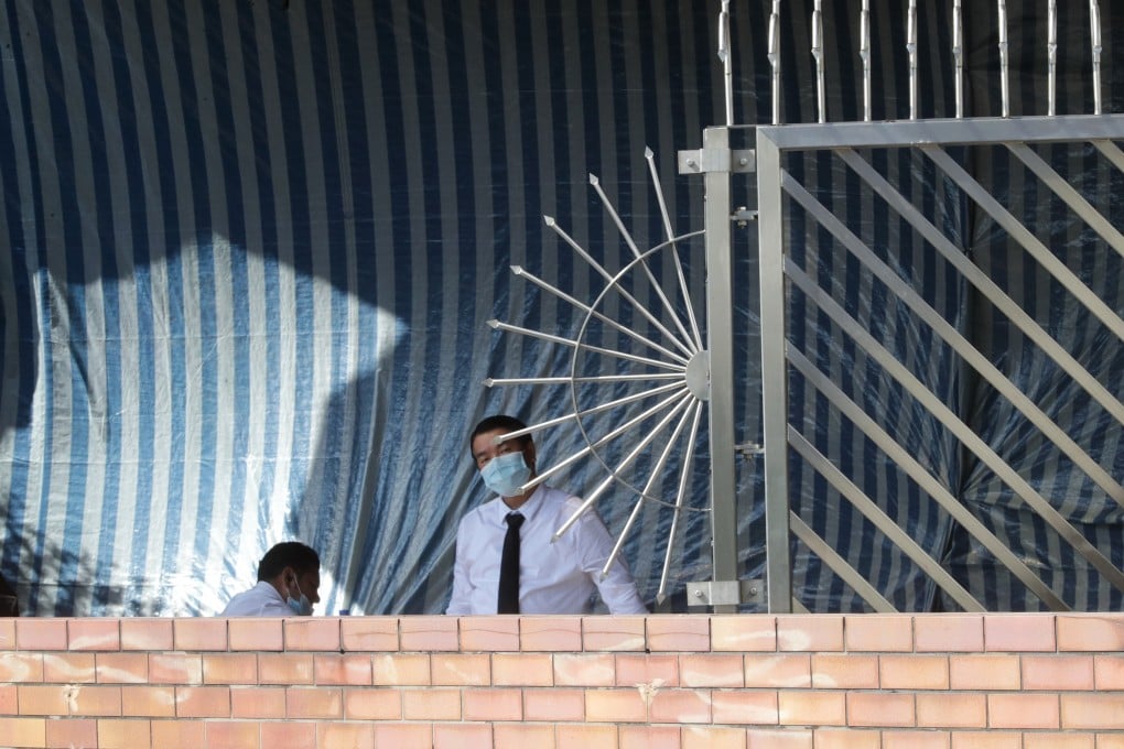 A security guards stands near a newly installed gate at an entrance to Polytechnic University’s campus in Hung Hom. Photo: Edmond So