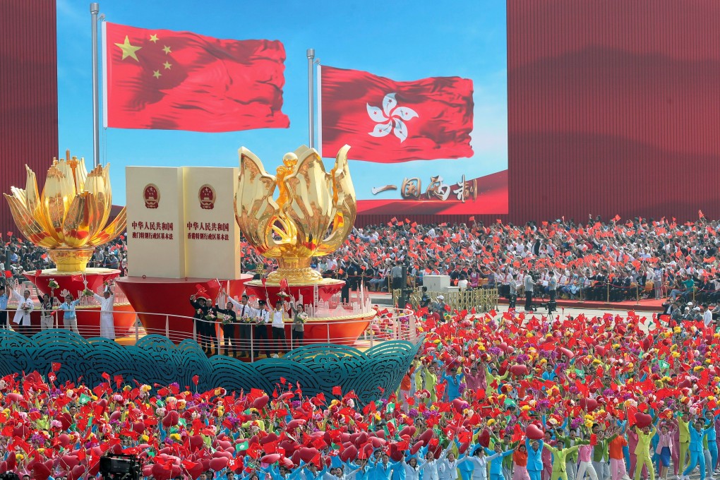 A float featuring the ‘one country, two systems’ policy passes Tiananmen Square during a National Day parade in Beijing. Photo: Reuters